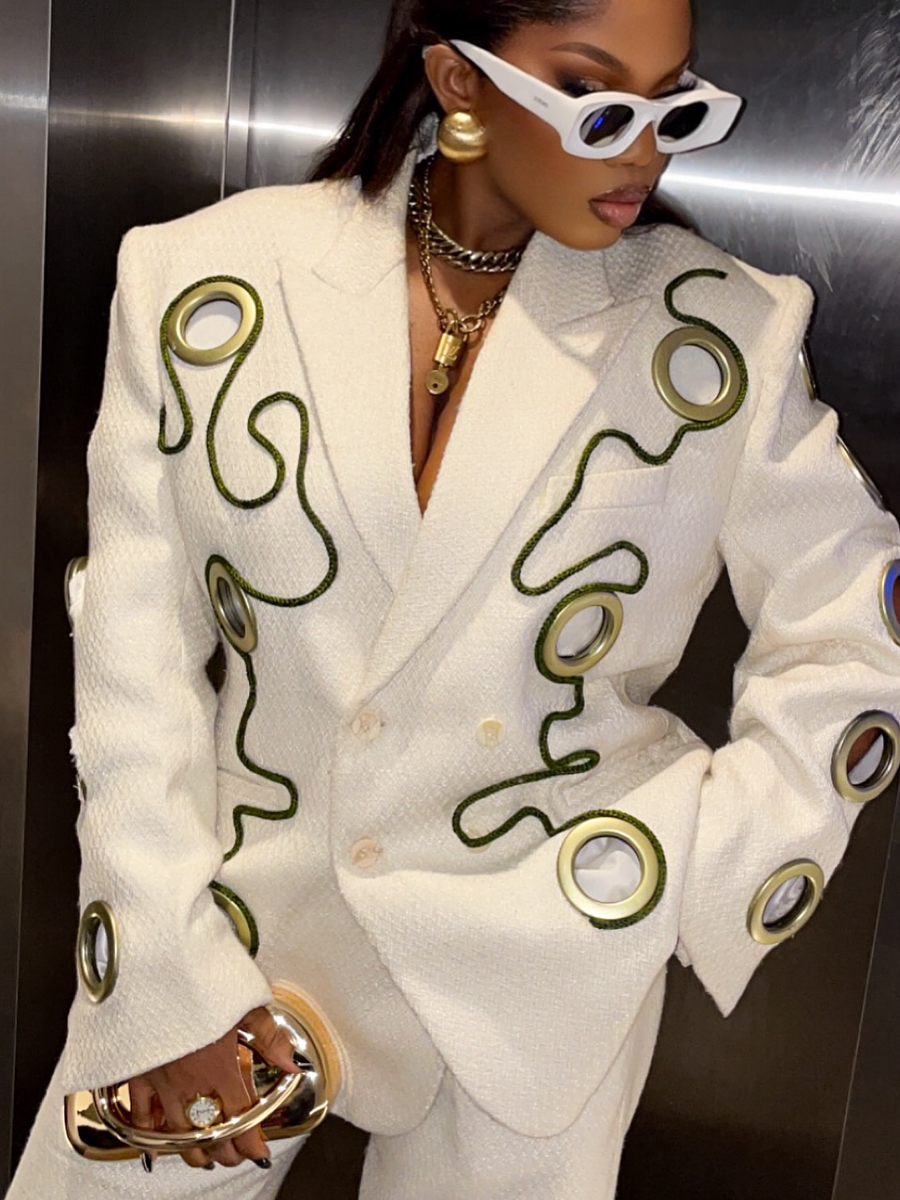 Metal Ring Decorated With Black Lines And White Suit Jacket