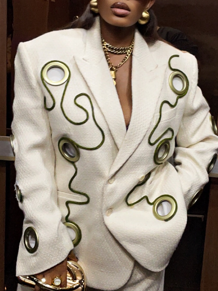 Metal Ring Decorated With Black Lines And White Suit Jacket